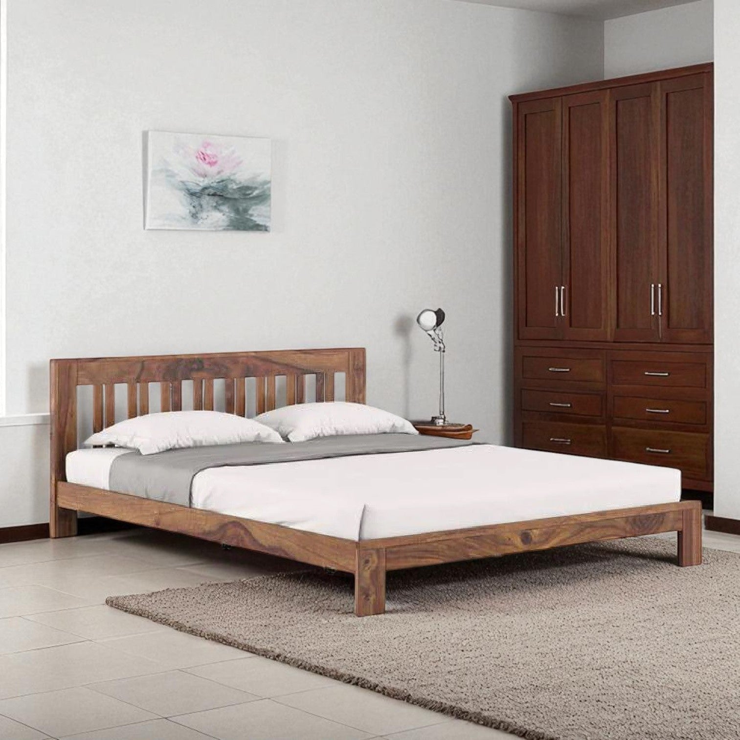 Wooden bed in a room with a wardrobe and decor elements.
