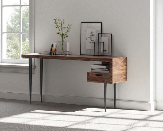 Wooden desk with a window in a room with light gray walls.