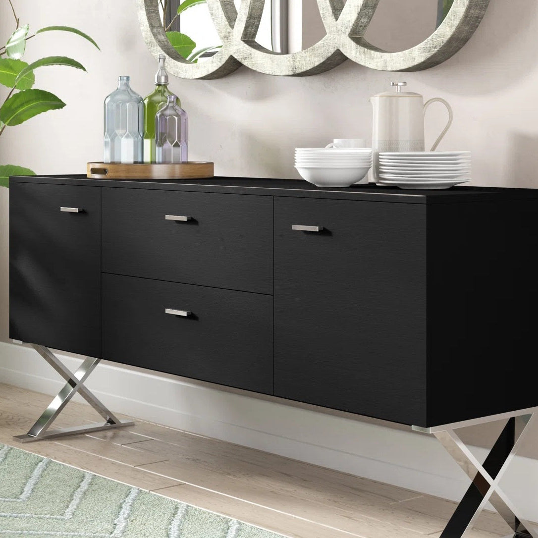 Black dresser with silver legs in a room setting