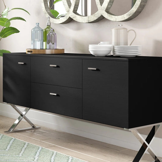 Black dresser with silver legs in a room setting