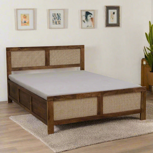Wooden bed frame with woven design on a white background