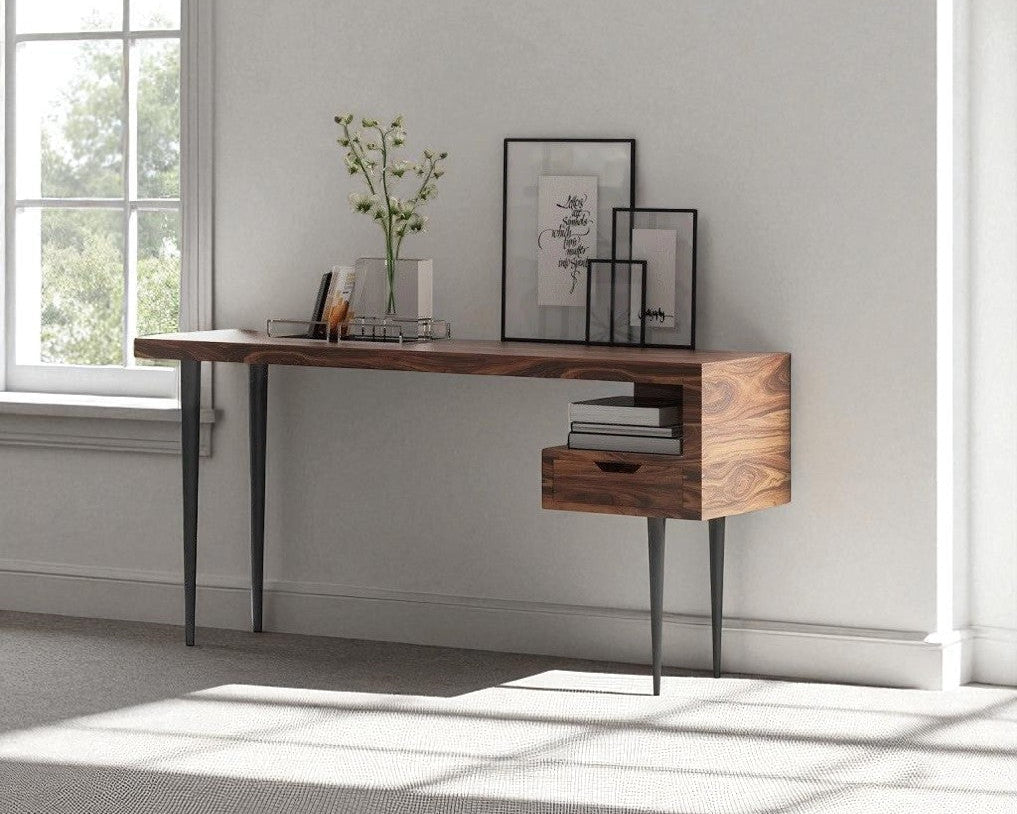 Wooden desk with a window in a room with light gray walls.